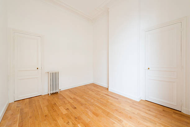 istock interior of empty room with parquet floor 613788736
