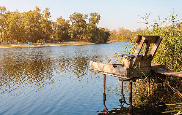 istock Fishing on a calm river in the morning 613789172