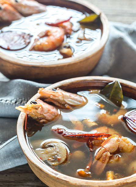 istock Two bowls of thai tom yum soup 613789776