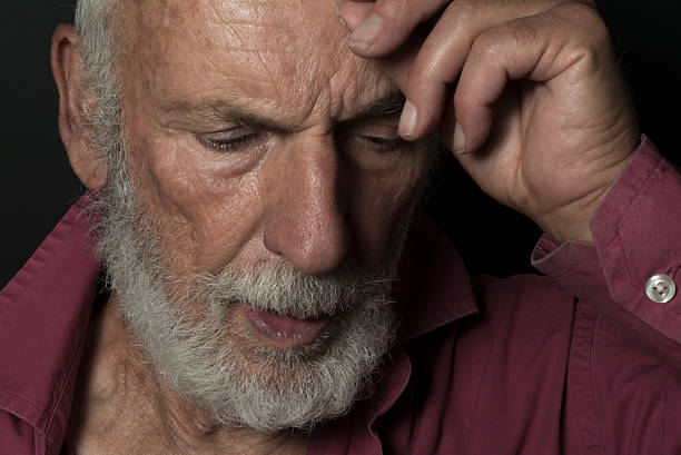 istock Thoughtful Old Guy, Desaturated Low-Key Grunge Gothic Lighting, Senior Man 613789780