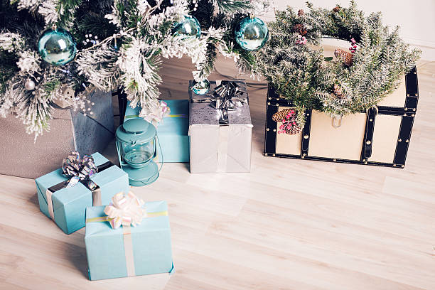 Close up decorated fir tree and gift boxes