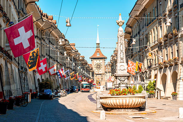 Street view in Bern city Street view on Kramgasse with fountain and clock tower in the old town of Bern city. It is a popular shopping street and medieval city centre of Bern, Switzerland bern photos stock pictures, royalty-free photos & images