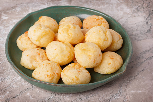 istock Brazilian snack cheese bread (pao de queijo) on plate 613792668