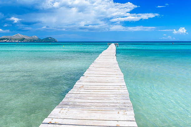 Pier at Playa Muro - Mallorca, balearic island of spain Pier at Playa Muro - beautiful coast and beach of Mallorca, balearic island of spain bay of alcudia stock pictures, royalty-free photos & images