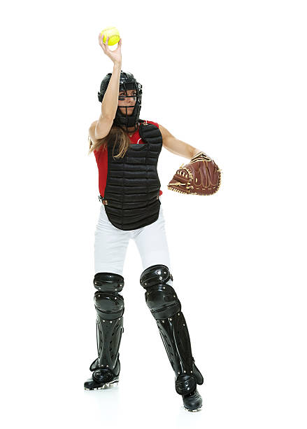 Female baseball player throwing Female baseball player throwing Chest Protector stock pictures, royalty-free photos & images