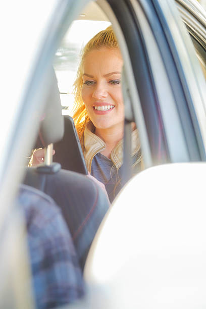 istock Woman in a Ride Share Taxi 613794764