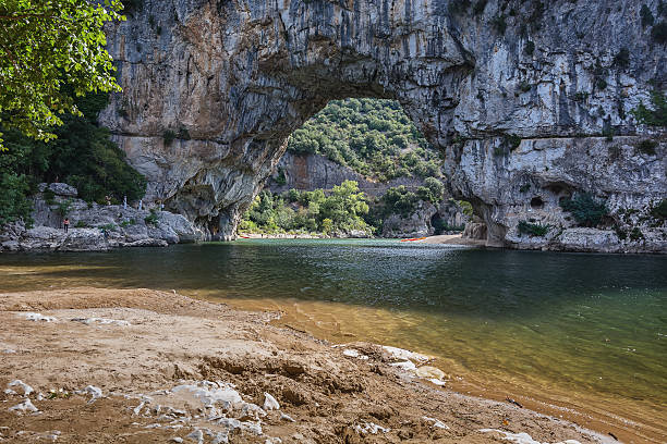 The Pont d'Arc is a large natural bridge, located in the Ardeche departement in the south of Franc. The arch, carved out by the Ardeche River, is 60 m wide and 54 m high.