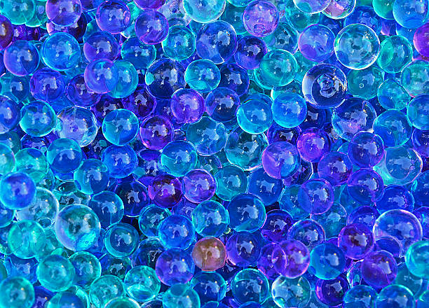 istock Blue sparkling pearls background.Abstract gel balls texture. 613861324