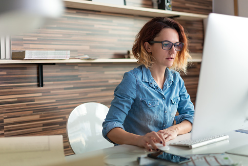 Female designer working in a design studio.