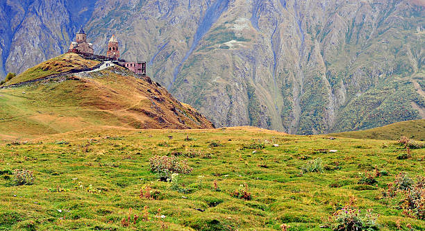 istock Scenic view of Trinity chapel in mountains 613861734