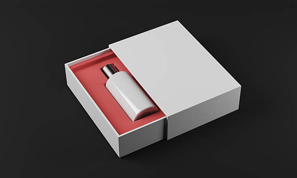 istock White bottle of perfume, black background 613861742