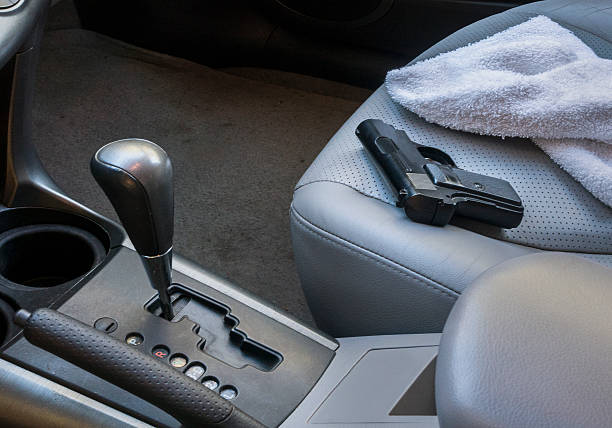 istock gun on car seat 613863512
