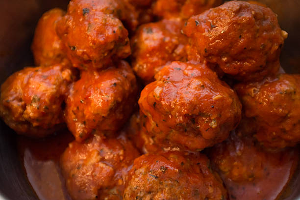 Closeup homemade Italian meatballs in red tomato sauce
