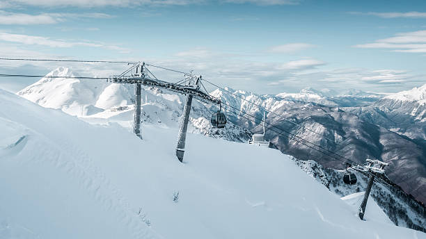 istock Winter landscape in mountains with cableway 613865850