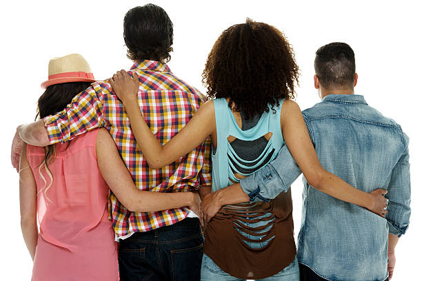 istock Four friends standing together 613866220
