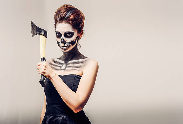 istock Beautiful woman with make-up skeleton 613869210