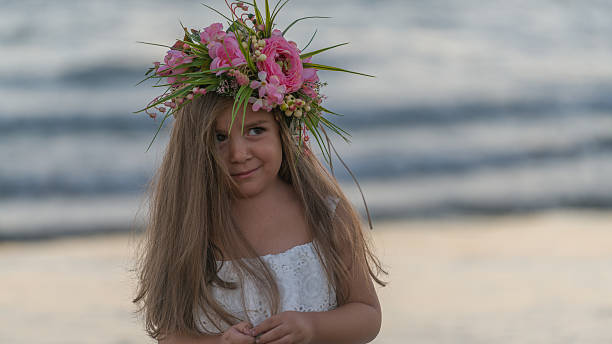 istock litle girl  on the beach sunset 613869370
