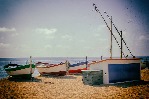 istock Fishing boats on a sandy beach in Spain 613871436