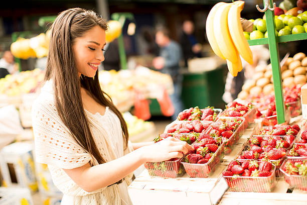 istock Young woman on market 613871778