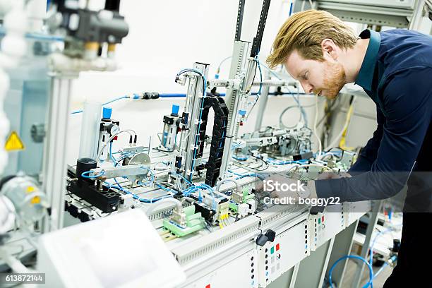 Engineer In The Factory Stock Photo - Download Image Now - Activity, Adult, Beautiful People