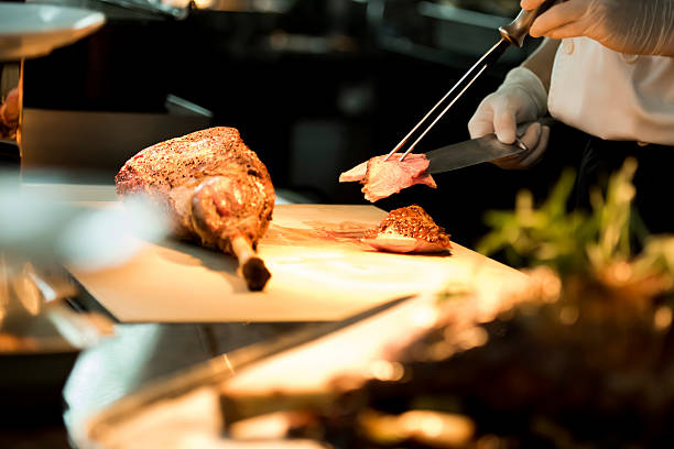 Roasted meat Chef cutting roasted meat carving set stock pictures, royalty-free photos & images