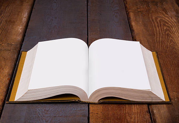 istock Open Bible on wooden boards 613874142
