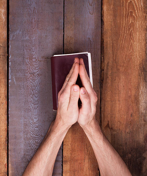 istock The prayer on the Bible. 613874242
