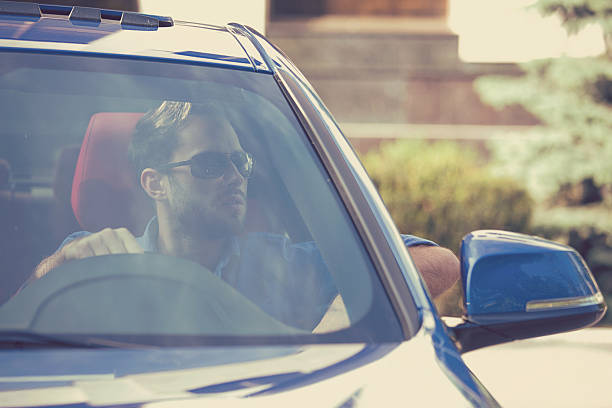 istock Confident man in his new car 613874462
