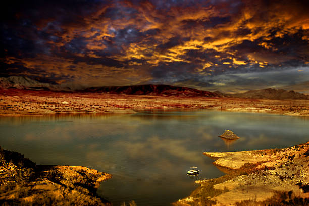 Fishing Boat on Lake during Colorful Sunset