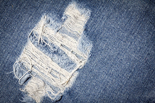 istock Denim jeans texture or denim jeans background with old torn. 613875344