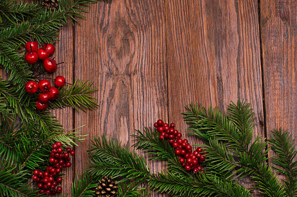 istock Christmas fir tree on wooden background 613875412