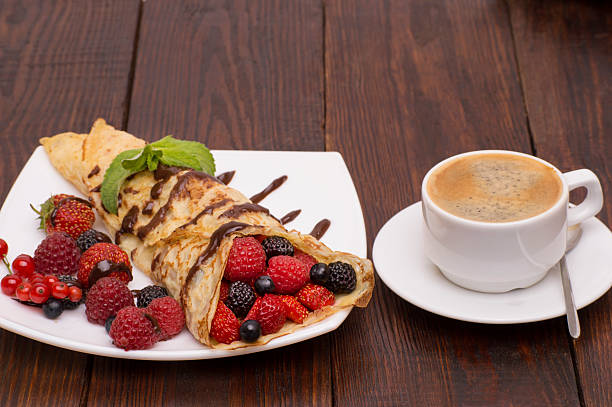istock Crepes With Berries and Chocolate topping 613875774
