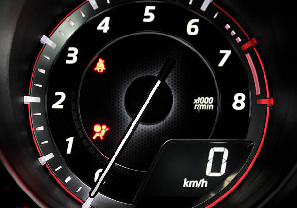istock Glowing needle at zero point on the car tachometer 613877606