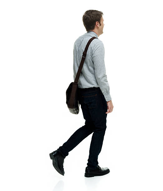 istock Rear view of businessman walking 613878674
