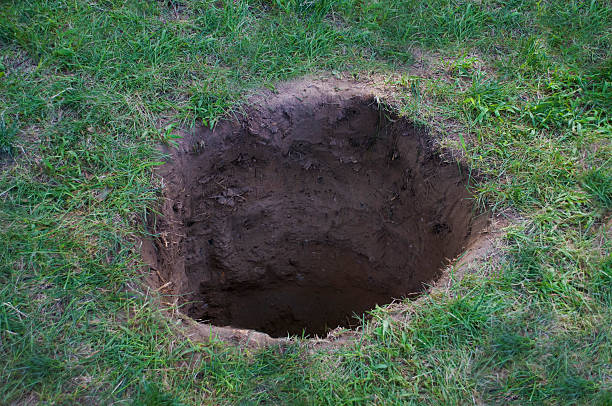 Deep Dirt Hole In Ground Or Lawn Stock Photo - Download Image Now - Hole,  Land, Dirt - iStock