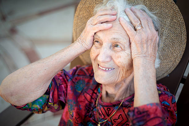 istock Beautiful Senior Woman Relaxing Outdoors in Back Yard 613881658