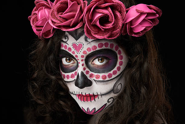 istock skull on woman face 613882078