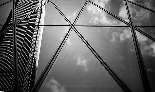 Photo of windows of business building with B&W color