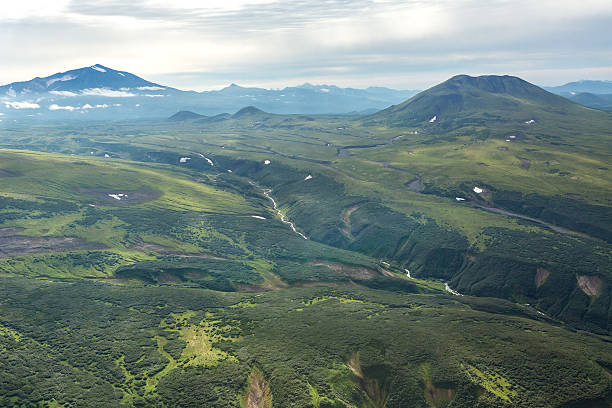 istock Glacial river between the hills. South Kamchatka Nature Park. 613884980