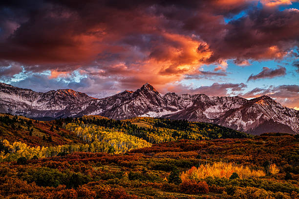 Fiery Autumn Sunset Dramatic sunset over Colorado's San Juan Mountains as seen from the Dallas Divide. sneffels range stock pictures, royalty-free photos & images