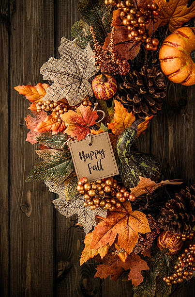 istock Ornate fall wreath with pumpkins, pinecones, message and leaves 613887570