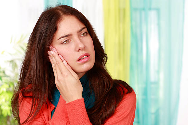 istock Woman suffering from tooth ache 613889120
