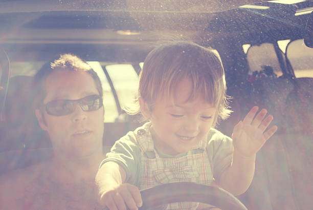 istock Child Pretending to Drive Car 613889978