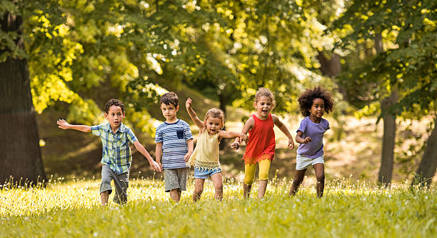 istock Small friends having fun while running together in nature. 613890258