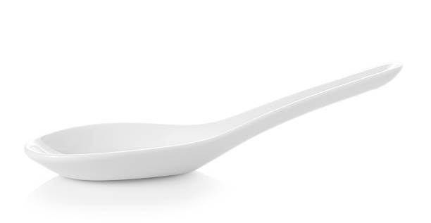 istock White Chinese soup spoon isolated on white background 613893686
