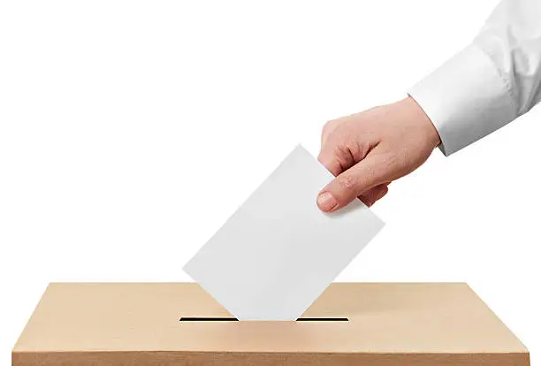 close up of  a ballot box and casting vote on white background