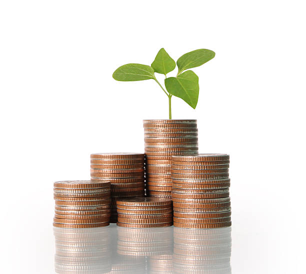 istock Coins graph stock market 613894066