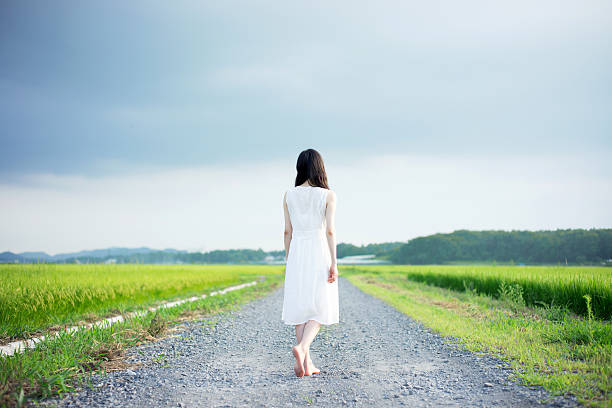 Woman standing in a rice paddy