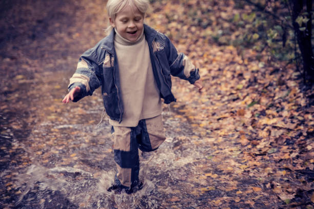 istock Boy in the park in autumn day 613899380