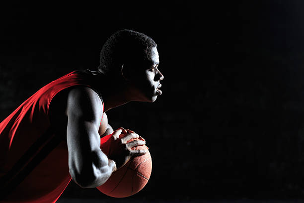 istock Side view of basketball player ready to shoot 613900420